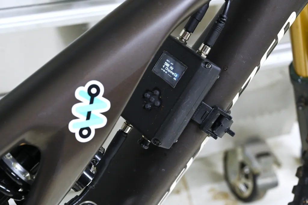 Close-up of a BODAQS logger installed on a mountain bike